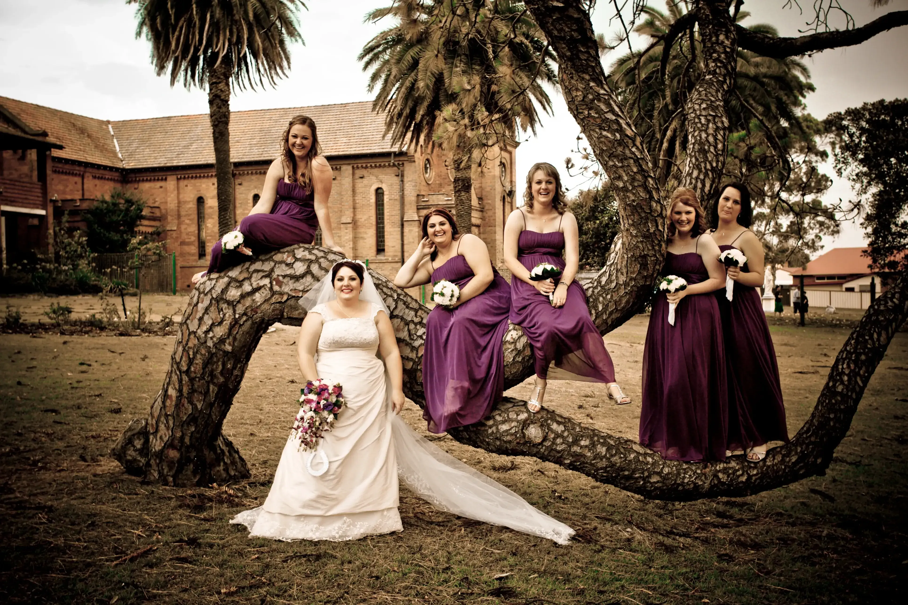 Bridal party photographed outdoors after a lakeside wedding, styled by Bellus