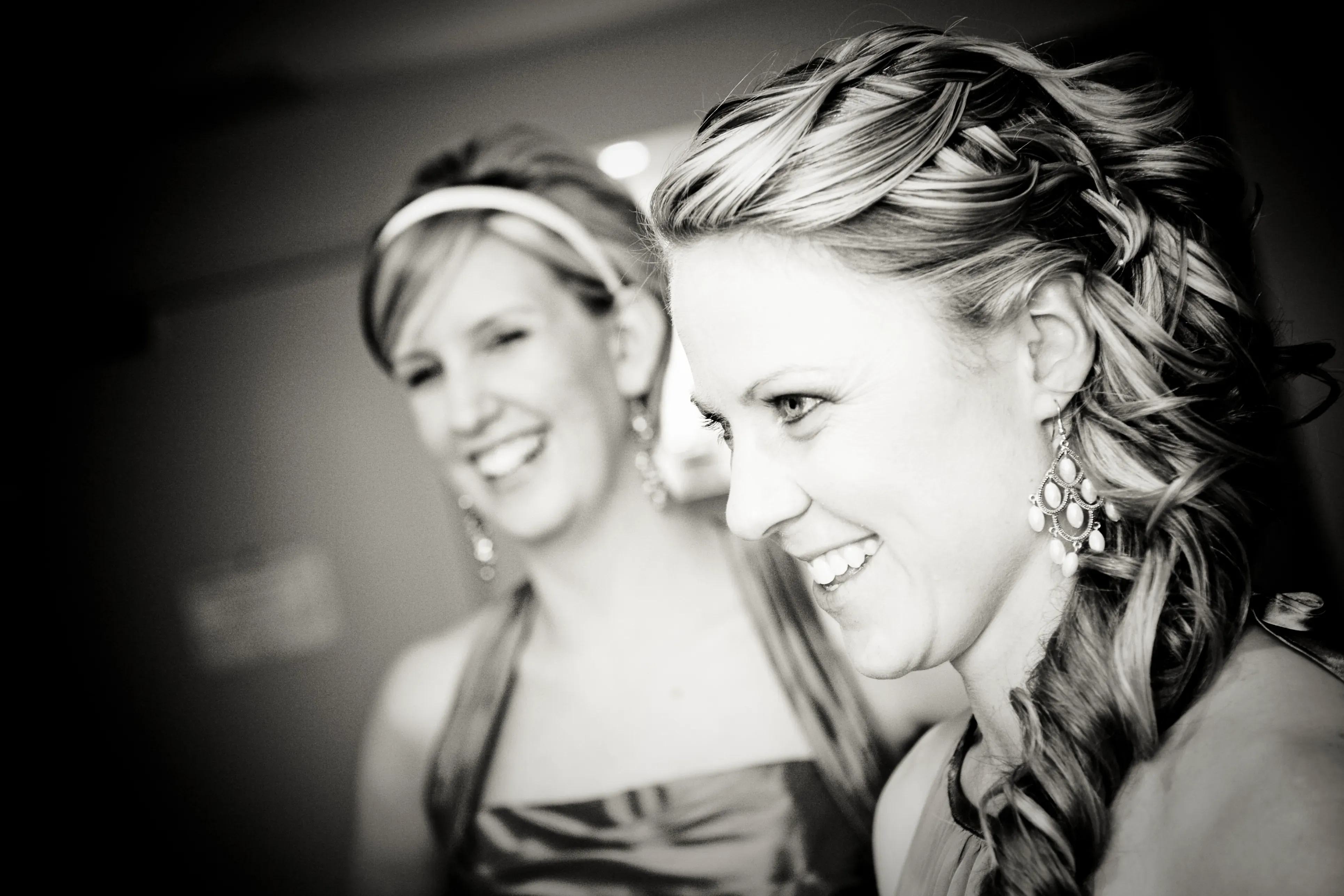 Bridesmaids laughing together as their hair is finished before a Hunter Valley wedding