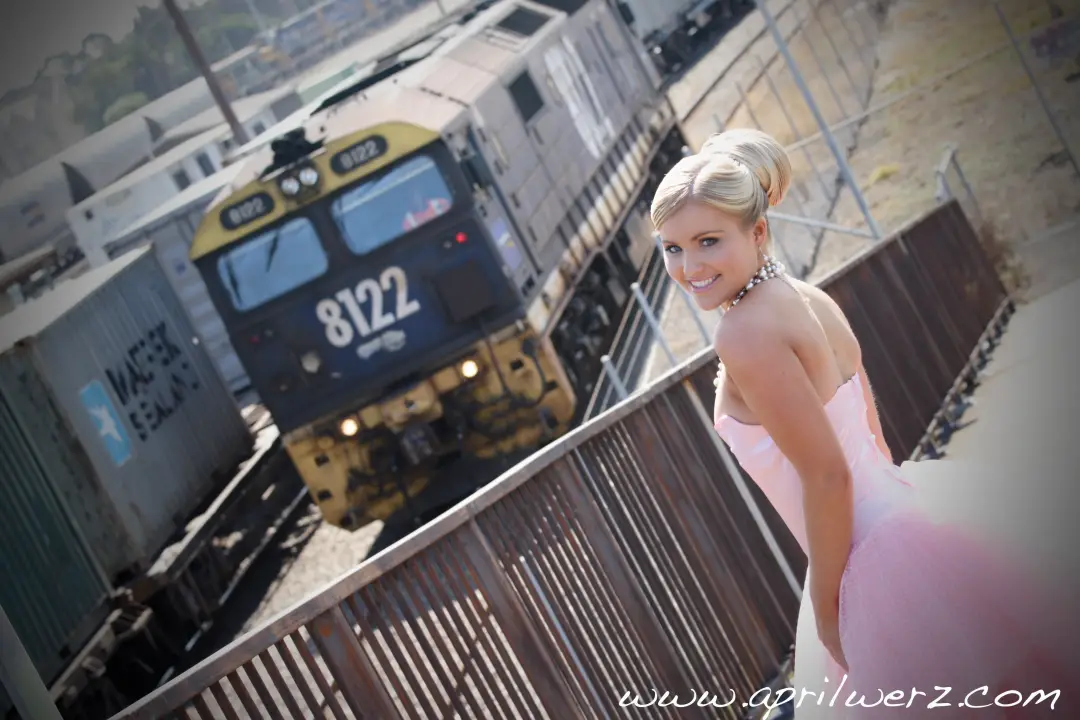 Guest by the railway line, her blonde hair twisted into a high pinned knot