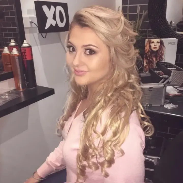 Half up hairstyle in long blonde curls, styled at a bridal hair and makeup trial in the studio