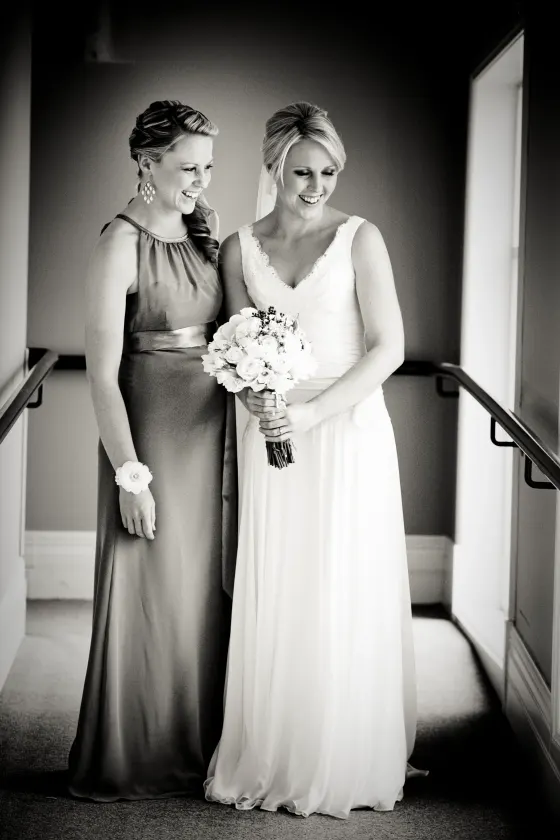Wedding hair and makeup, the bride and her bridesmaid before the ceremony